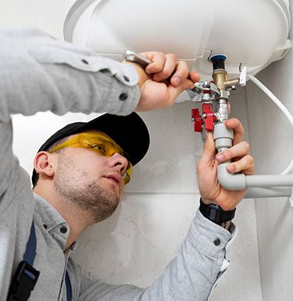worker-repairing-water-heater (1)